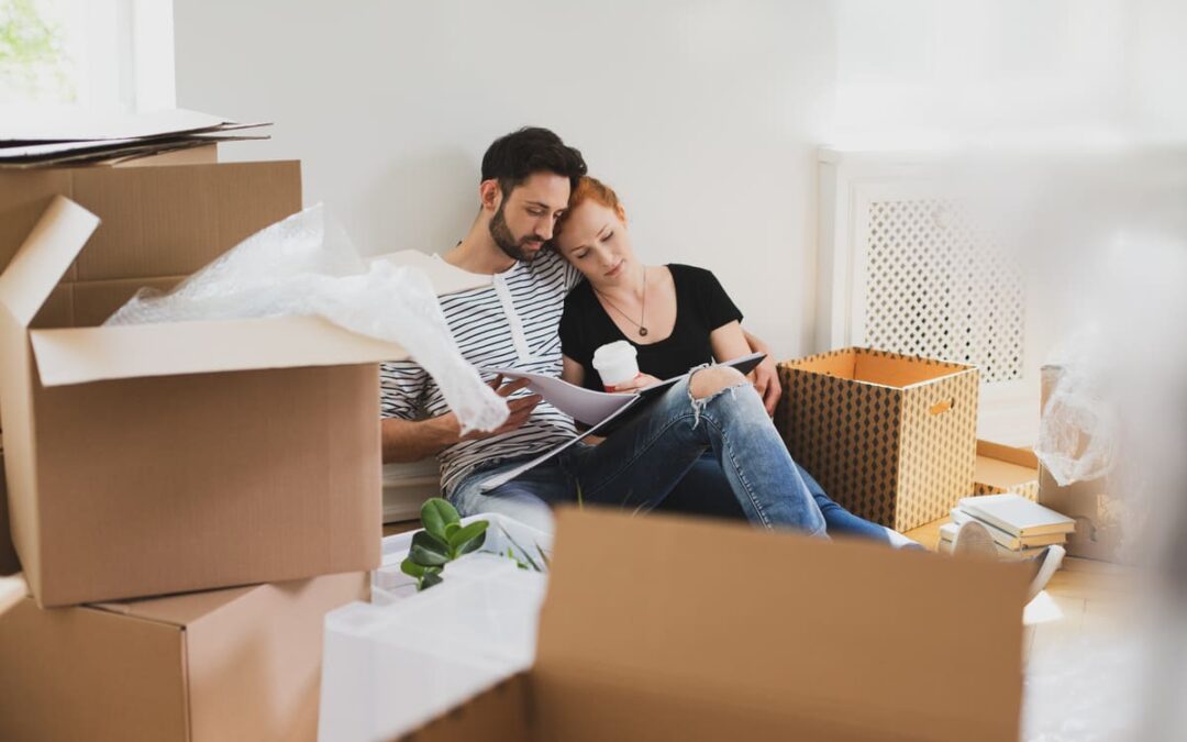 couple surrounded by boxes